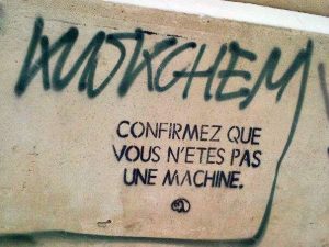 French graffito: Confirm you're not a machine