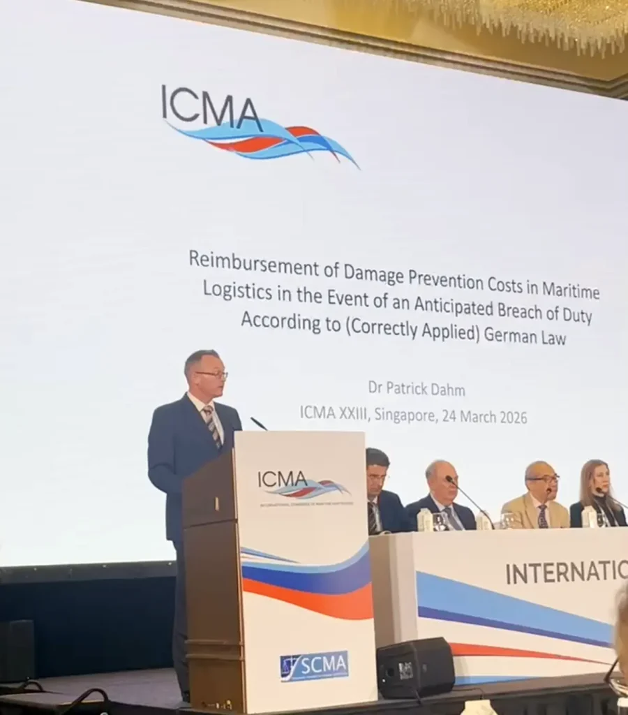 Dr Patrick Dahm at the podium presenting his paper on damage prevention costs in maritime logistics at ICMA XXIII, Singapore, March 2026